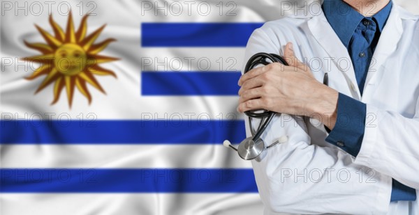 Uruguay healthcare concept. Doctor with stethoscope on Uruguay flag. Doctor holding stethoscope on
