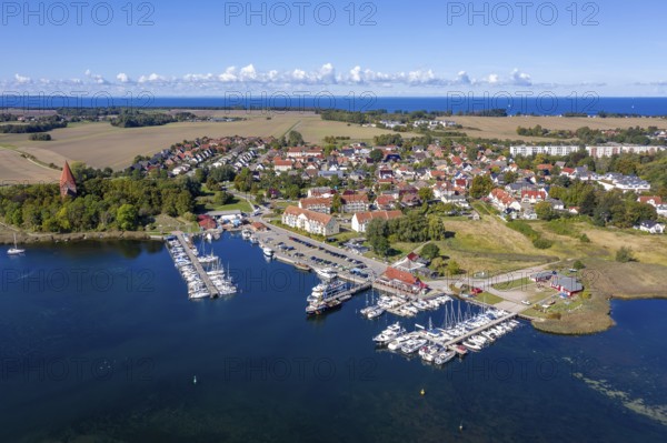 Aerial view over sailing boats in the harbour, marina of the village Kirchdorf in the Bay of
