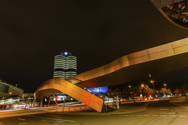 Federally illuminated BMW world, Petuelring, the BMW headquarters office tower in the back, Munich,