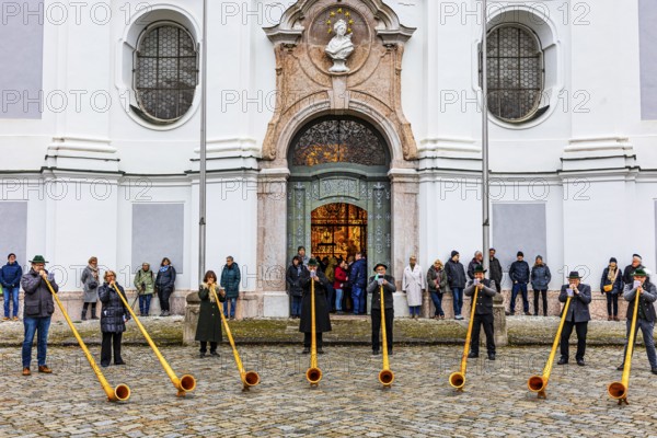 Alphorn group playing in front of Marienmünster in Dießen am Lake Ammer, Upper Bavaria, Bavaria,