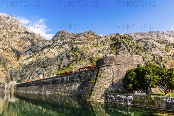 Fortress wall to the North Gate, medieval town of Kotor with winding alleys, rich in historical