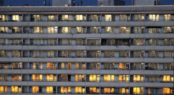Prefabricated high-rise building with illuminated apartments on Alexanderplatz, Berlin, 05.11.2025,