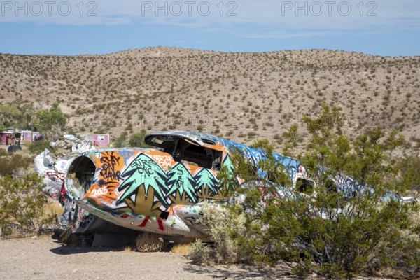 Beatty, Nevada - A decorated twin-engine airplane lies in the desert after a 1977 crash. The