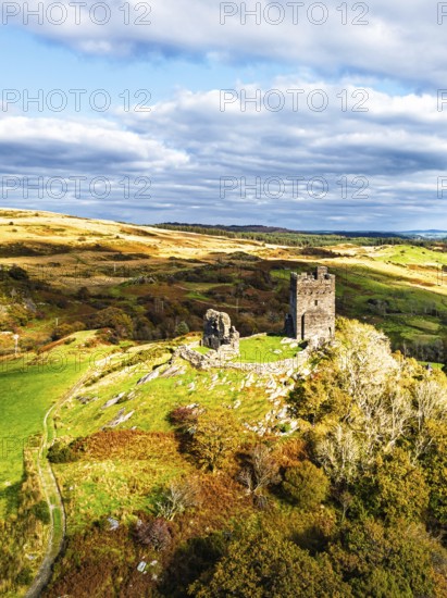 Autumn colours over Castell Dolwyddelan and Eryri Mountains from a drone, Snowdonia, Conwy County
