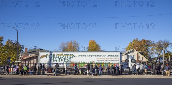 Detroit, Michigan USA - 4 November 2025 - People wait in line to pick up groceries from the
