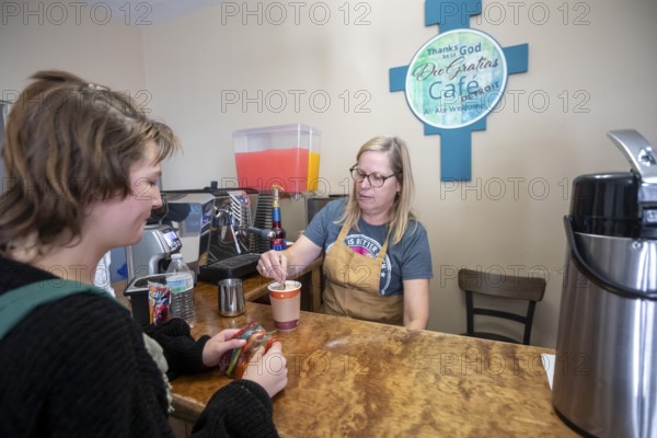 Detroit, Michigan USA - 4 November 2025 - A volunteer makes coffee for a client at the nonprofit