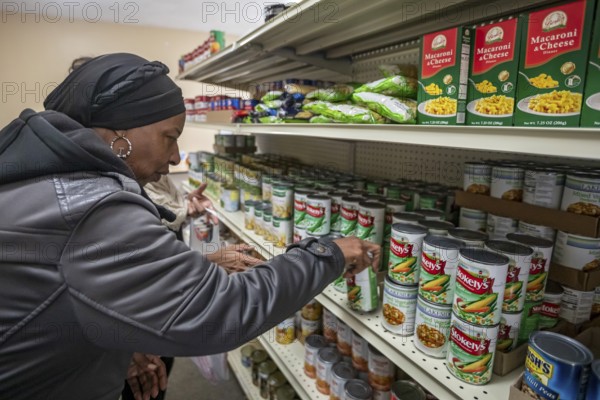 Detroit, Michigan USA - 4 November 2025 - People pick up groceries at the nonprofit Deo Gratias