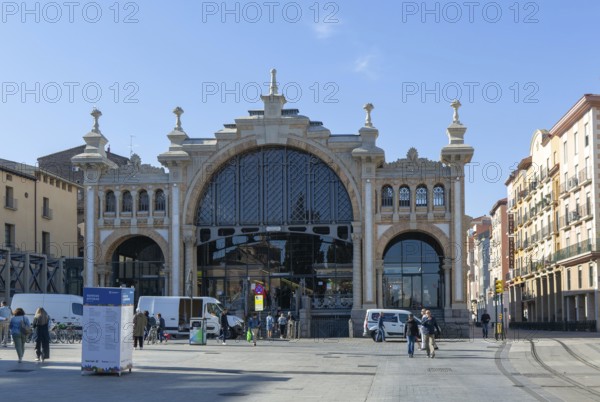 People vehicles street by central market building, Mercado Central de Zaragoza, Zaragoza, Aragon,
