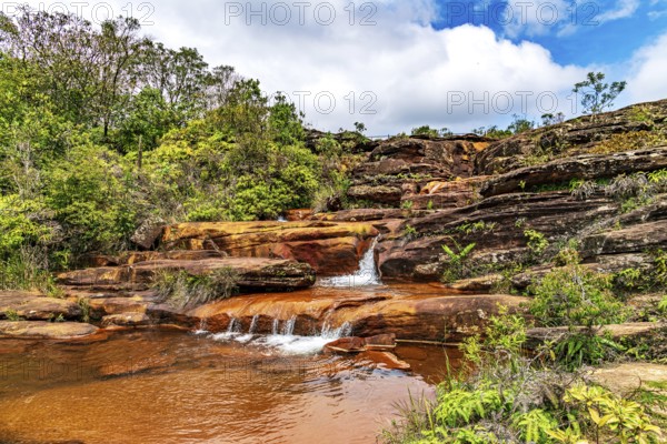 Stream flowing over rocks and forming small waterfalls in the state of Minas Gerais, Brazil, Minas