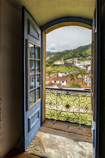 The city of Ouro Preto viewed through the doorway of one of its historic Baroque churches, Ouro