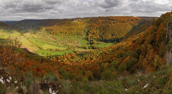 Panoramic picture of Indian Summer on the Swabian Jura in the Nenninger Valley with Reussenstein