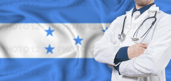 Honduras healthcare concept. Male doctor on Honduras flag. Doctor with crossed arms on Honduras