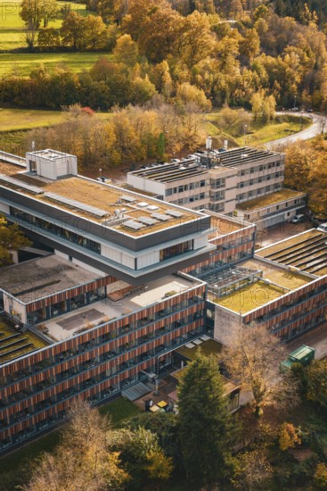 Modern buildings with green roofs in the midst of an autumn landscape, Calw District Office, Calw,