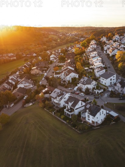 Residential area on the edge of a settlement in autumn sunset light, Deufringen, Aidlingen,