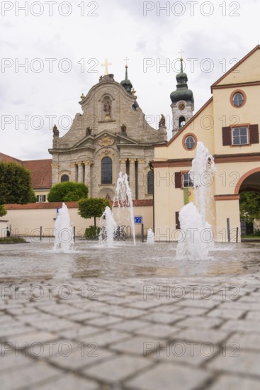 Historic church with fountain in the foreground, baroque architecture and cobblestones, ZFP