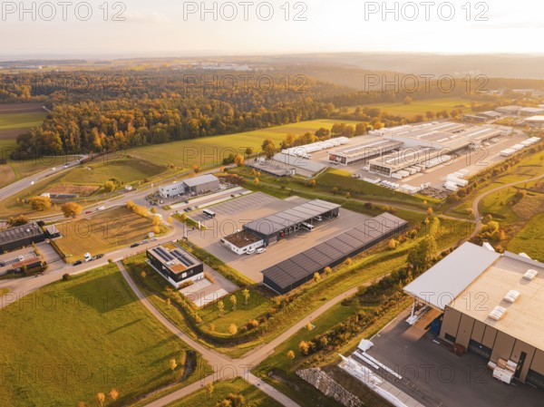 Industrial area on the edge of the forest, seen from above in autumn light, Nagold, Black Forest,