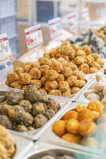 Colourful vegetarian foods displayed in rows at a market stand, Streuobstmarkt, Sindelfingen,