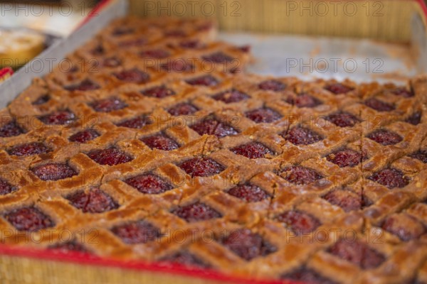 Large raspberry cake with grid pattern presented on a tray, Streuobstmarkt, Sindelfingen, Böblingen