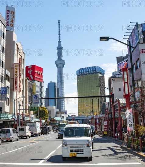 Street with typical Japanese houses, Sumida City skyline in the back, Sumida City Office, Tokyo