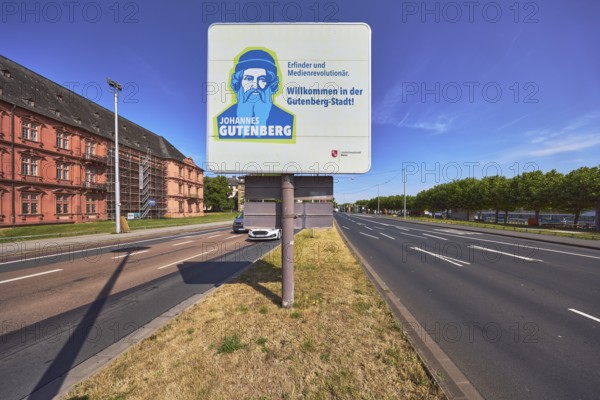 Welcome to Gutenberg City, tourist sign, roads, lanes, central island, lantern, trees, lawn, blue