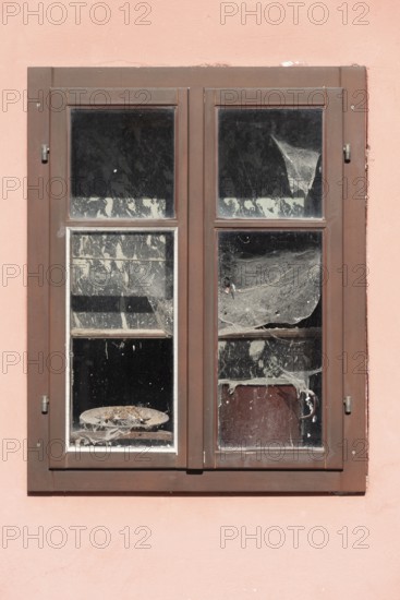 Pink house facade, window with old objects, Kranj, Upper Carniola, Slovenia