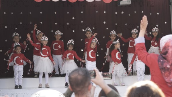 Children celebrate the 102nd anniversary of the Republic Day of Turkey, a national holiday