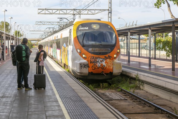 Renfe Civia commuter train at platform of Airport railway station, Rodalia de Barcelona suburban