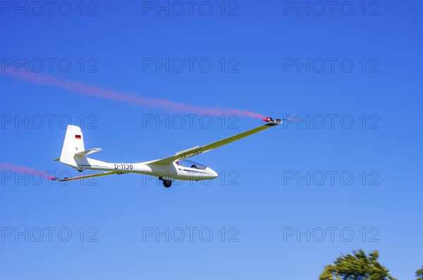 An SZD-59-1 ACRO glider, registration D-1138, during a demonstration as part of an air show at the
