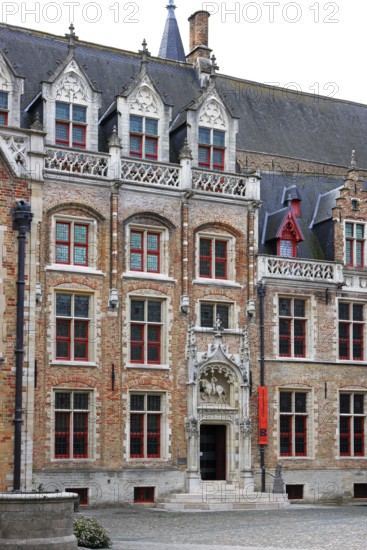 Gruuthusemuseum with equestrian statue of Lodewijk van Gruuthuse above the entrance portal in the