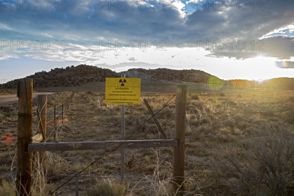 Jeffrey City, Wyoming - The sun rises behind a 'No Trespassing' signs which adorns the perimeter of
