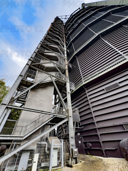 View steeply upwards on the outside with left external staircase of former Gasometer Oberhausen