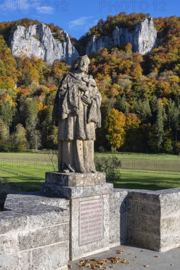 Statue, saint statue of Saint Nepomuk, patron saint of bridges, bridge saint on the historic arched