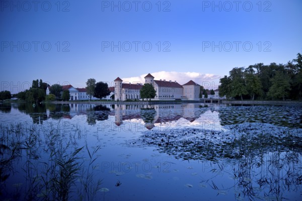 Rheinsberg Castle, lakeside with Lake Grienerick at night, prime example of Friederician Rococo,
