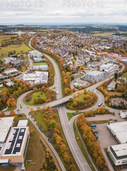 Urban area with roads and buildings in autumn colors seen from a bird's eye view, Dornstetten,
