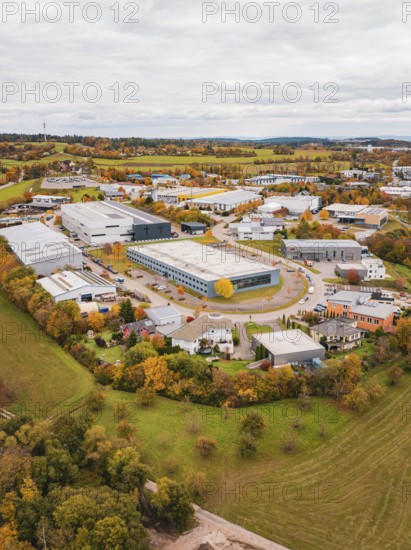 Large industrial area in autumn surroundings, bird's-eye view of houses and fields, Dornstetten,
