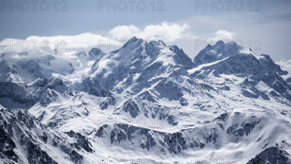 View of mountain panorama with mountain peaks of the Bernina Group, mountain landscape in winter,