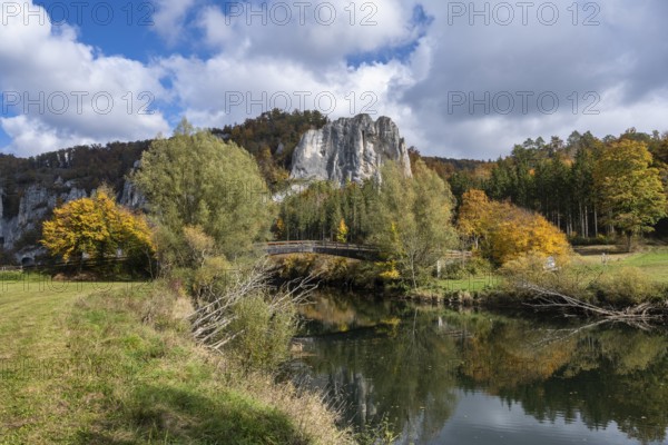 Wooden bridge across the Danube in the Upper Danube Valley, surrounded by autumn vegetation,