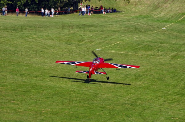 A Soviet Jakovlev Jak-55 sport aircraft with the registration LY-TOY during a flight demonstration
