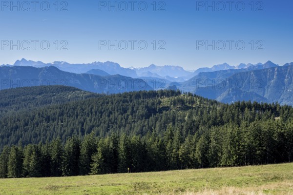 View from Stoisser Alm in Chiemgau of the Berchtesgaden and Chiemgau Alps and the wooded Teisenberg