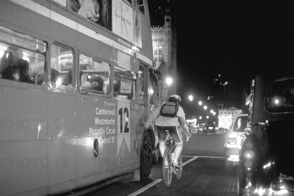 London at night, bus and cyclist on Westminster Bridge, black and white, London, England, Great