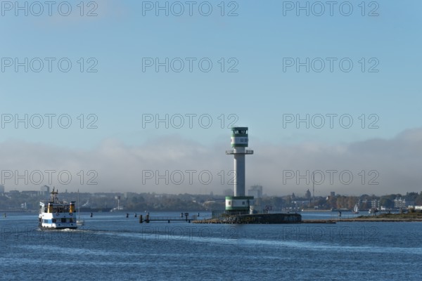Green-white lighthouse Friedrichsort with city panorama of the state capital, Kiel Fjord, Kiel,