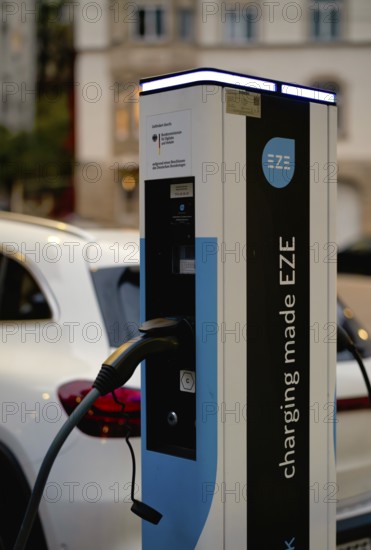 Parking lot with gas pump, EZE Network charging station, SICHARGE model for electric cars, charging