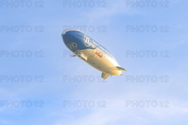Zeppelin under a clear, cloudless sky, carrying an advertising message, Überlingen, Lake Constance,