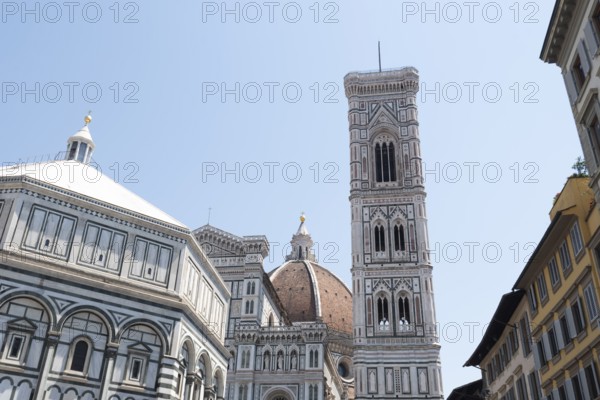 On the left Baptistery of San Giovanni, center dome of the Cathedral of Santa Maria del Fiore, on