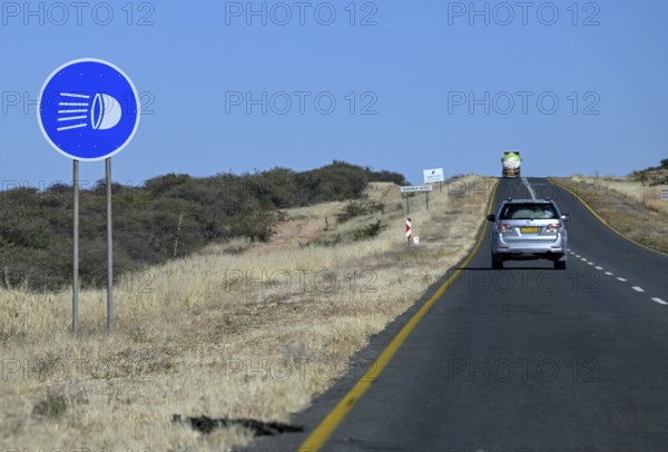 Light requirement sign for overland journeys on the B1 highway between Windhoek and Otjiwarongo,