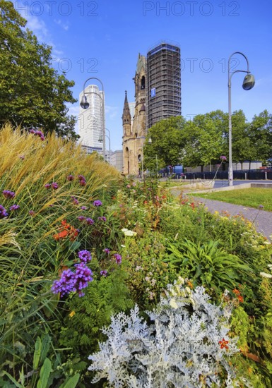 Planted middle strip of Tauentzienstraße with Kaiser Wilhelm Memorial Church, promenade,