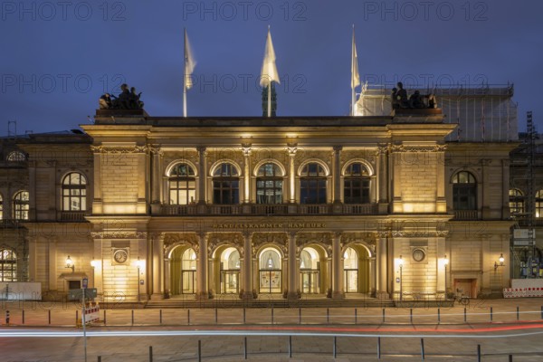 Building of the Hamburg Chamber of Commerce at blue hour with a strip of light in the foreground,