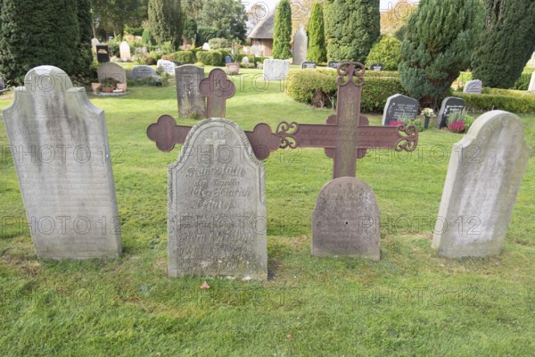Cemetery of St John's Church with gravestones telling the story of seafarers, known as talking