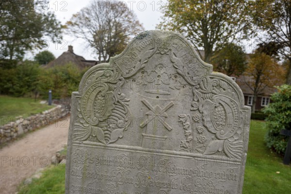 Close-up of a baroque gravestone in the cemetery of St John's Church, Nieblum, Föhr Island,