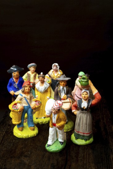 Colorful Provençal terracotta figurines represent traditional characters from rural life. Each